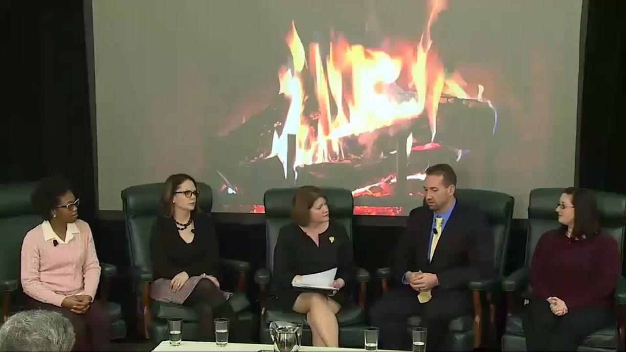 fireside chat participants seated in front of fireplace image