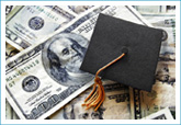 graduation cap sitting on top of a pile of money