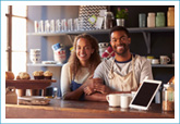 owners of small business standing at the check out counter