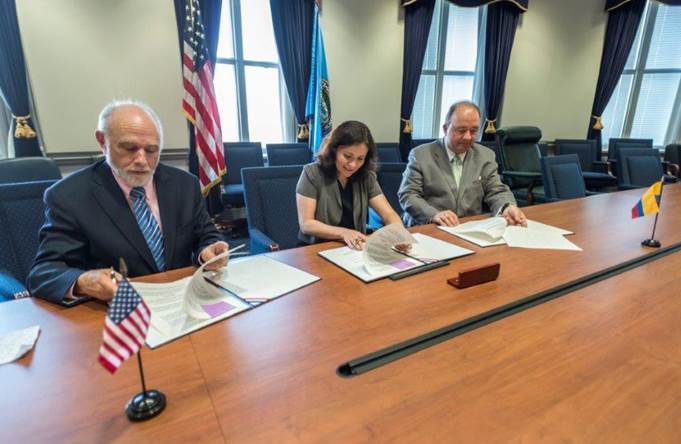 People signing the Memorandum of Understanding